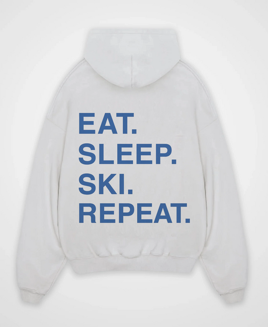 EAT. SLEEP. SKI. REPEAT. OVERSIZED HOODIE